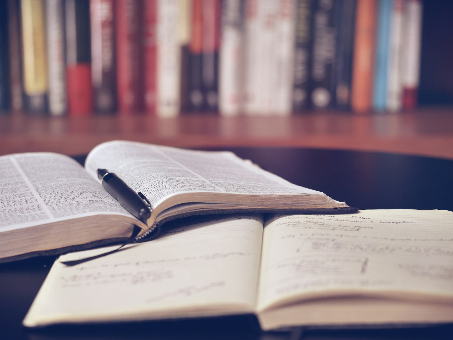 Marked page with pencil beside statute volumes